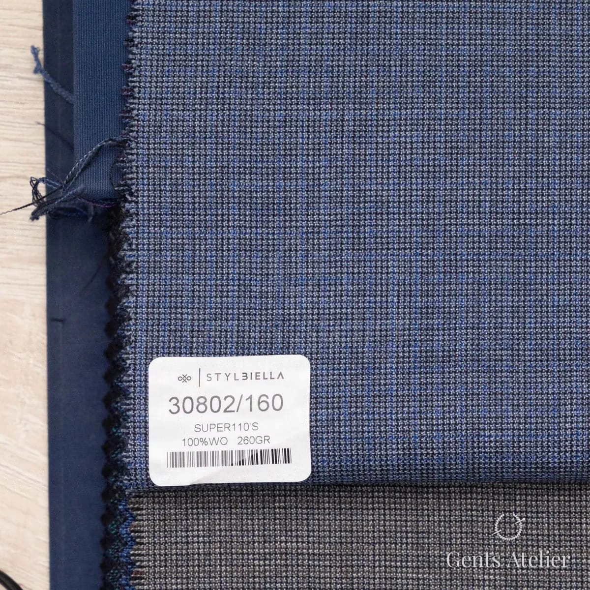 Образец ткани Stylbiella 30802/160 с этикеткой, синий