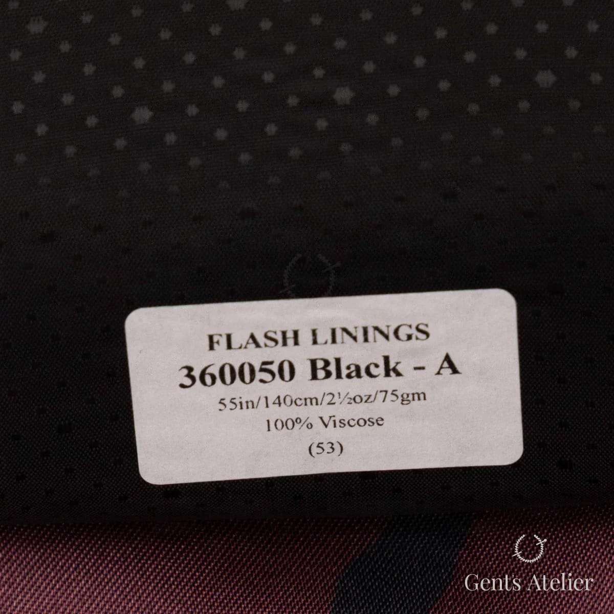 Образец ткани Gladson 360050 Black - A с этикеткой, чёрный с тональным жаккардовым узором в мелкую звёздочку