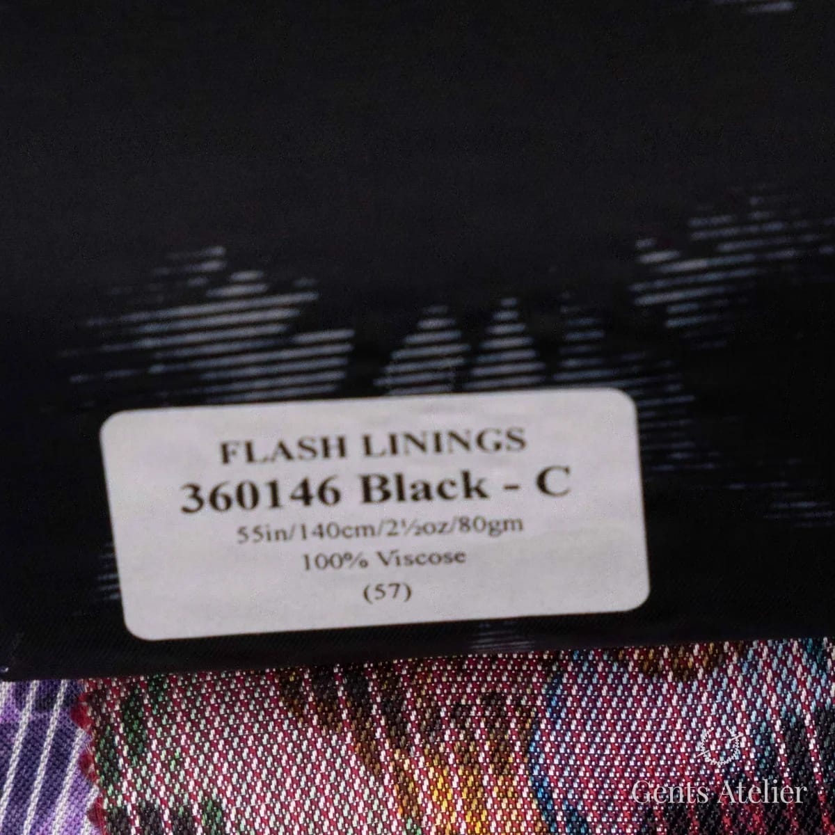Образец ткани Gladson 360146 Black - C с этикеткой, чёрный с тональным жаккардовым рисунком из треугольников