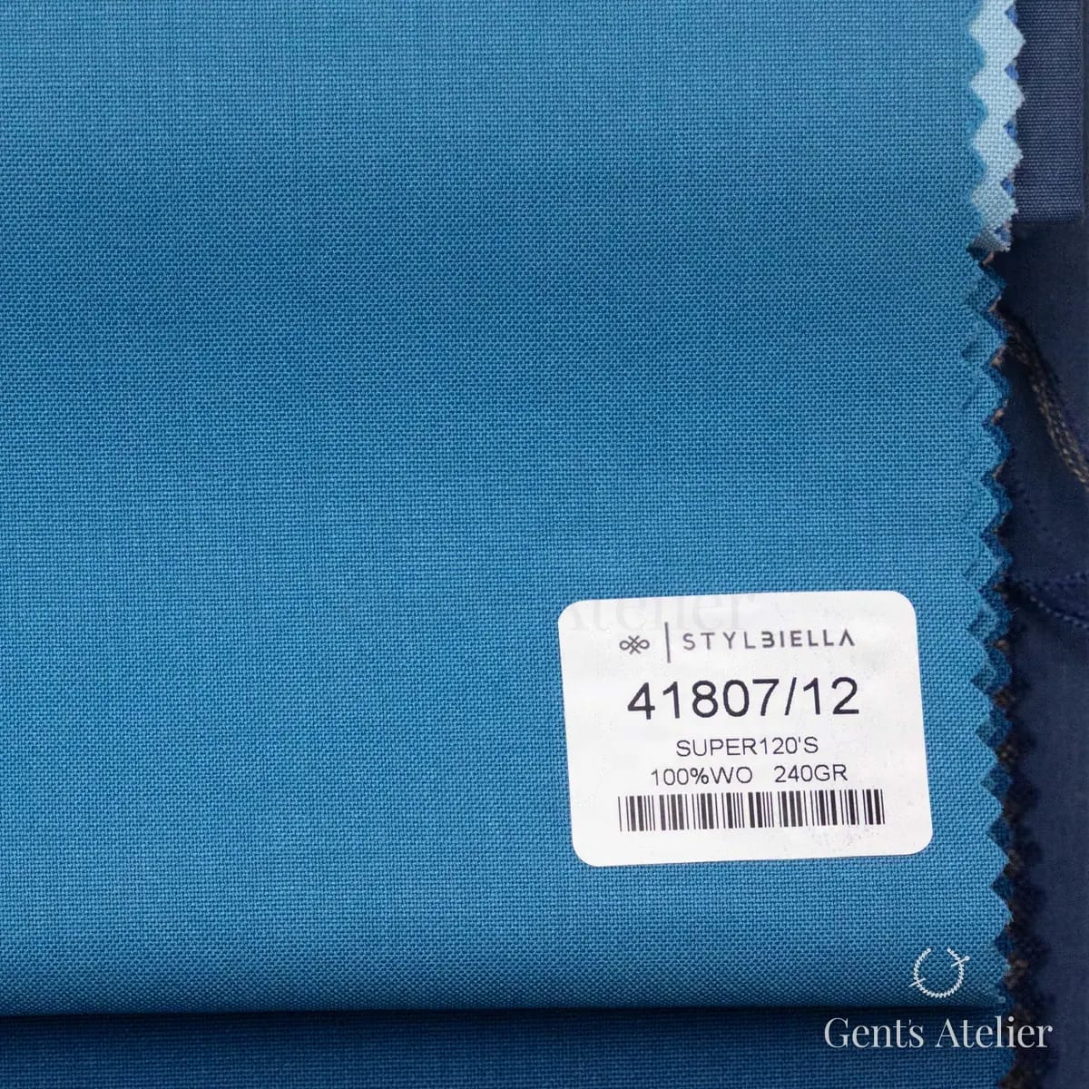Образец ткани Stylbiella 41807/12 с этикеткой, бирюзово-синий